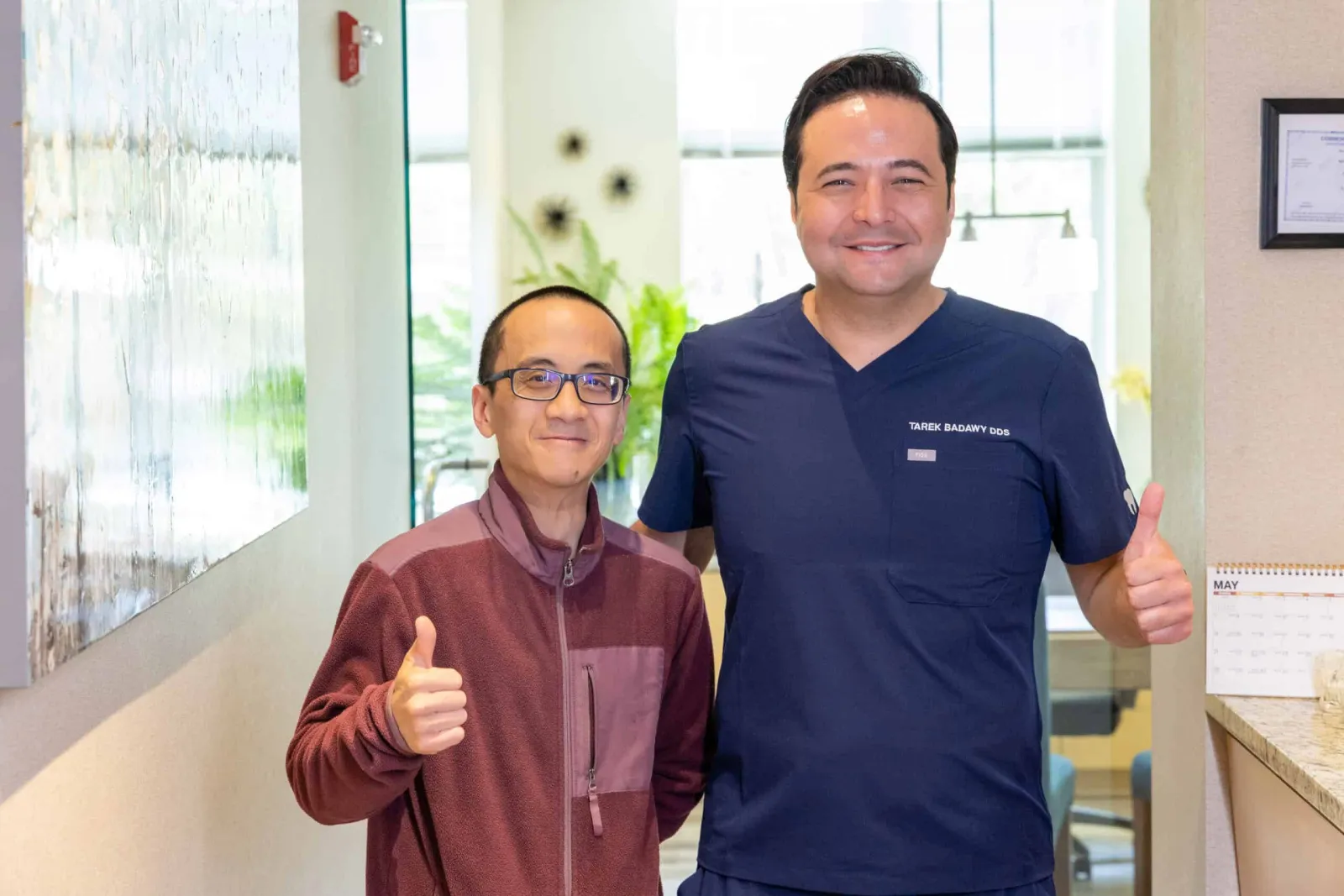 Dr. Tarek Badawy with a Westlake Dental guest, all smiles after treatment